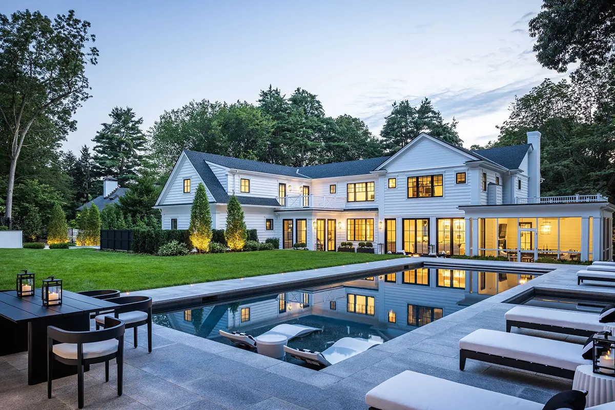 Backyard pool oasis with outside dining area, house in background